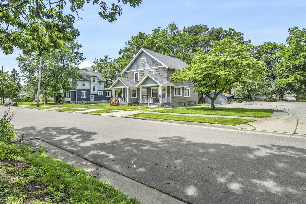 Tree-lined residential street with family homes